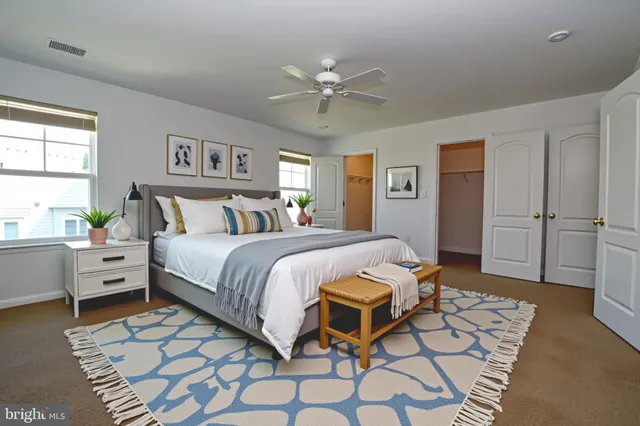 a bedroom with a bed and a table