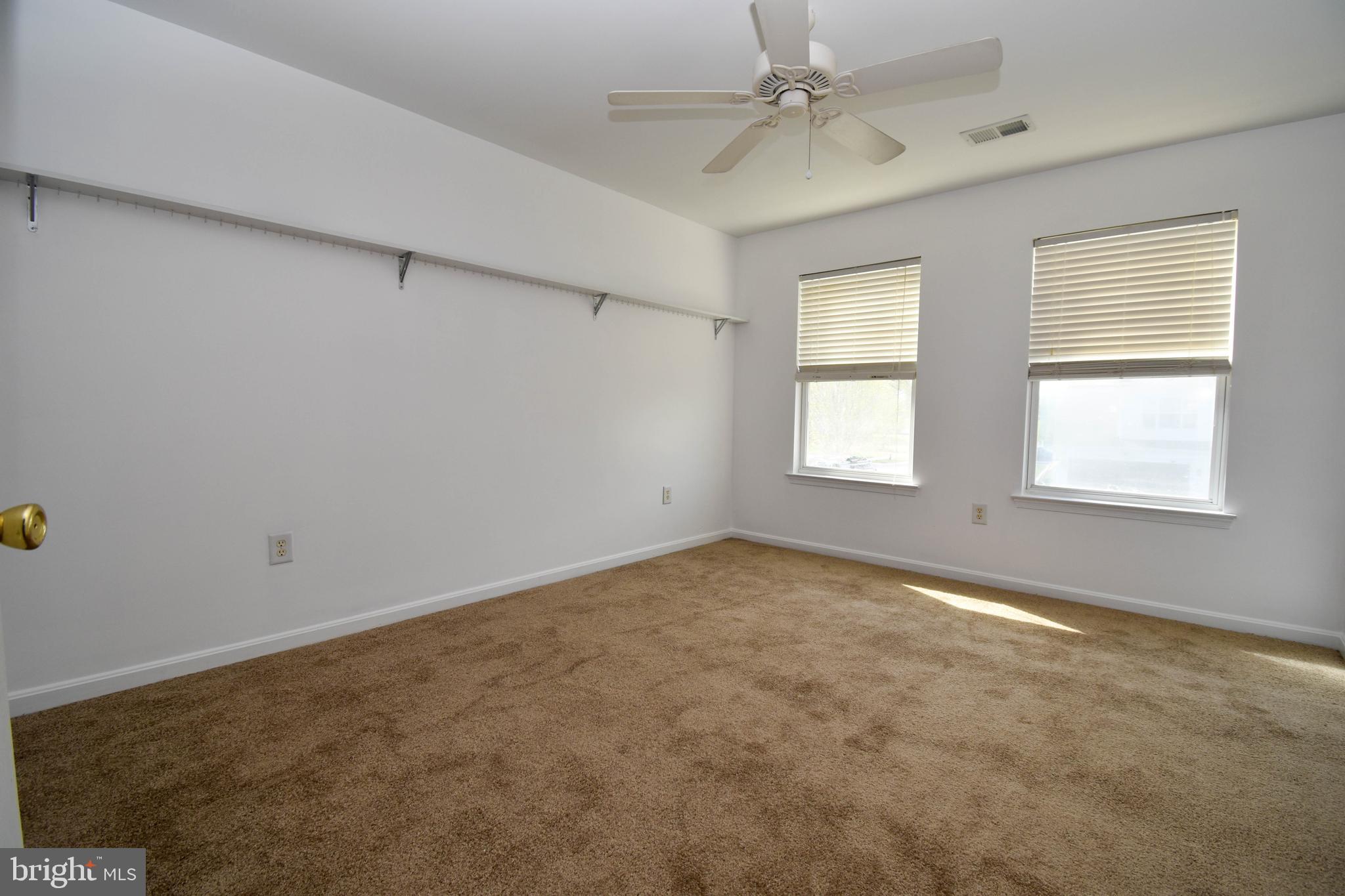 29549 Whitstone Lane, Unit 1305 Millsboro, DE 19966 - Photo 20 of 31 a view of an empty room with a window