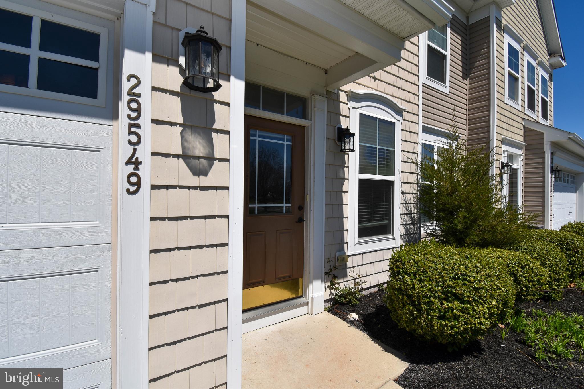 29549 Whitstone Lane, Unit 1305 Millsboro, DE 19966 - Photo 2 of 31 a view of building with door space
