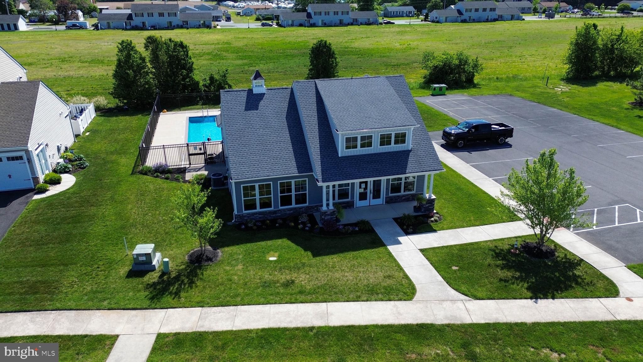 29549 Whitstone Lane, Unit 1305 Millsboro, DE 19966 - Photo 28 of 31 an aerial view of a house with a yard