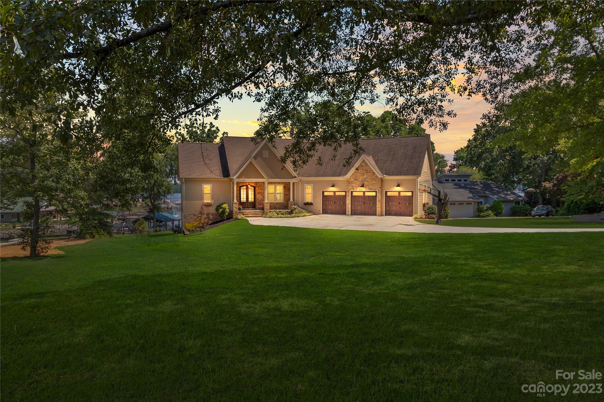 a front view of a house with a garden