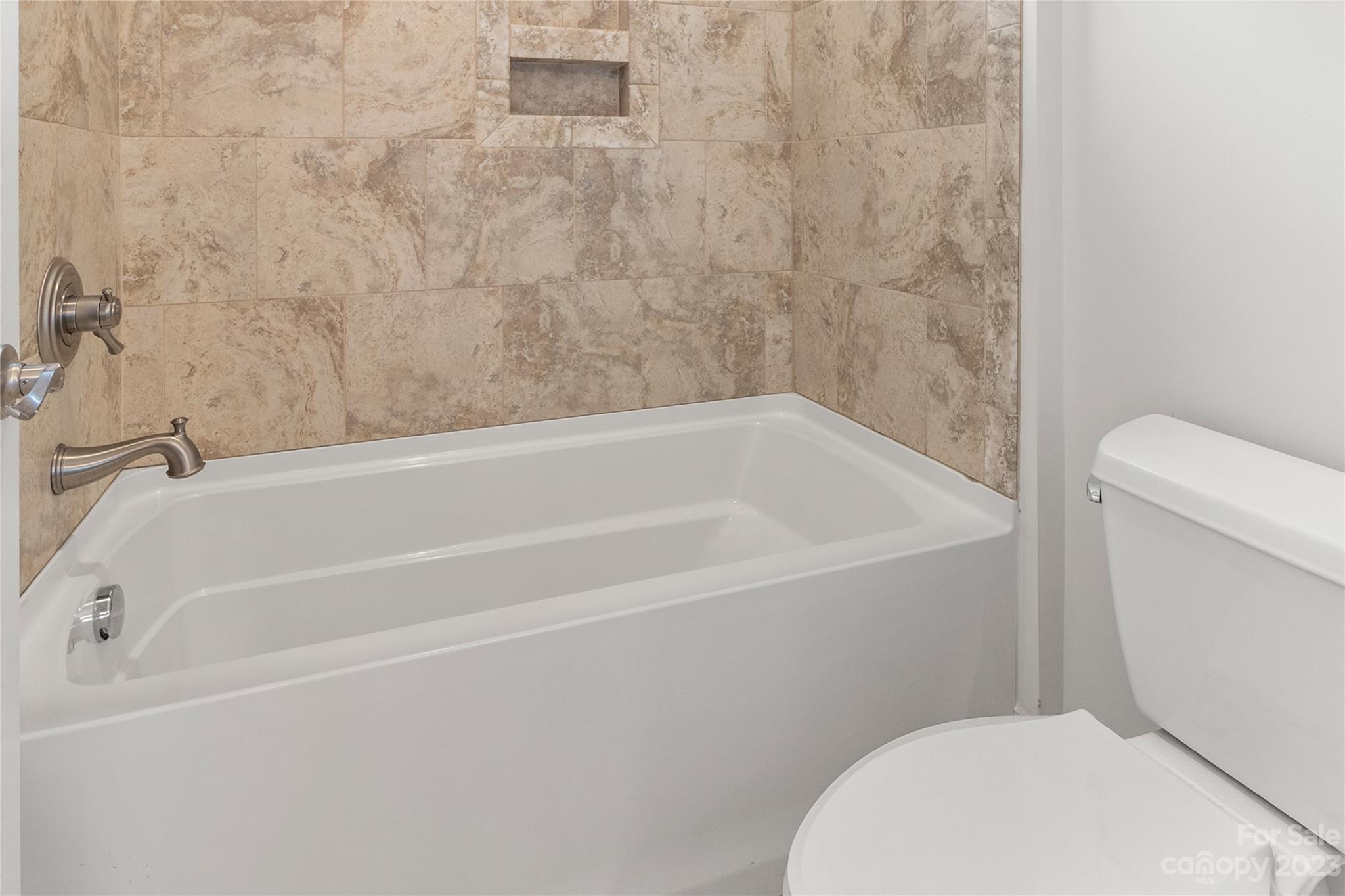 2500 Primm Road Denver, NC 28037 - Photo 20 of 46 a white bath tub sitting next to a toilet