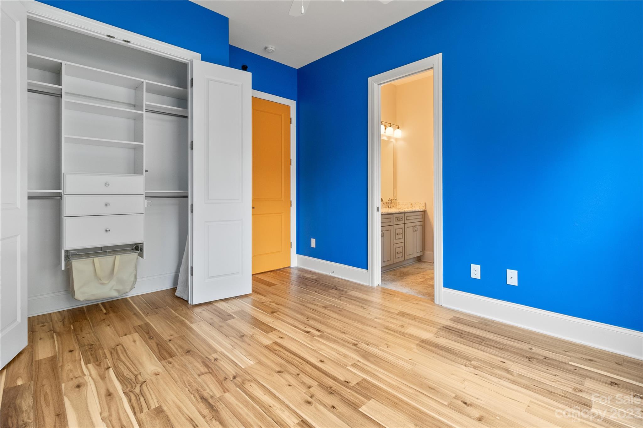 2500 Primm Road Denver, NC 28037 - Photo 21 of 46 a view of an empty room with closet and wooden floor