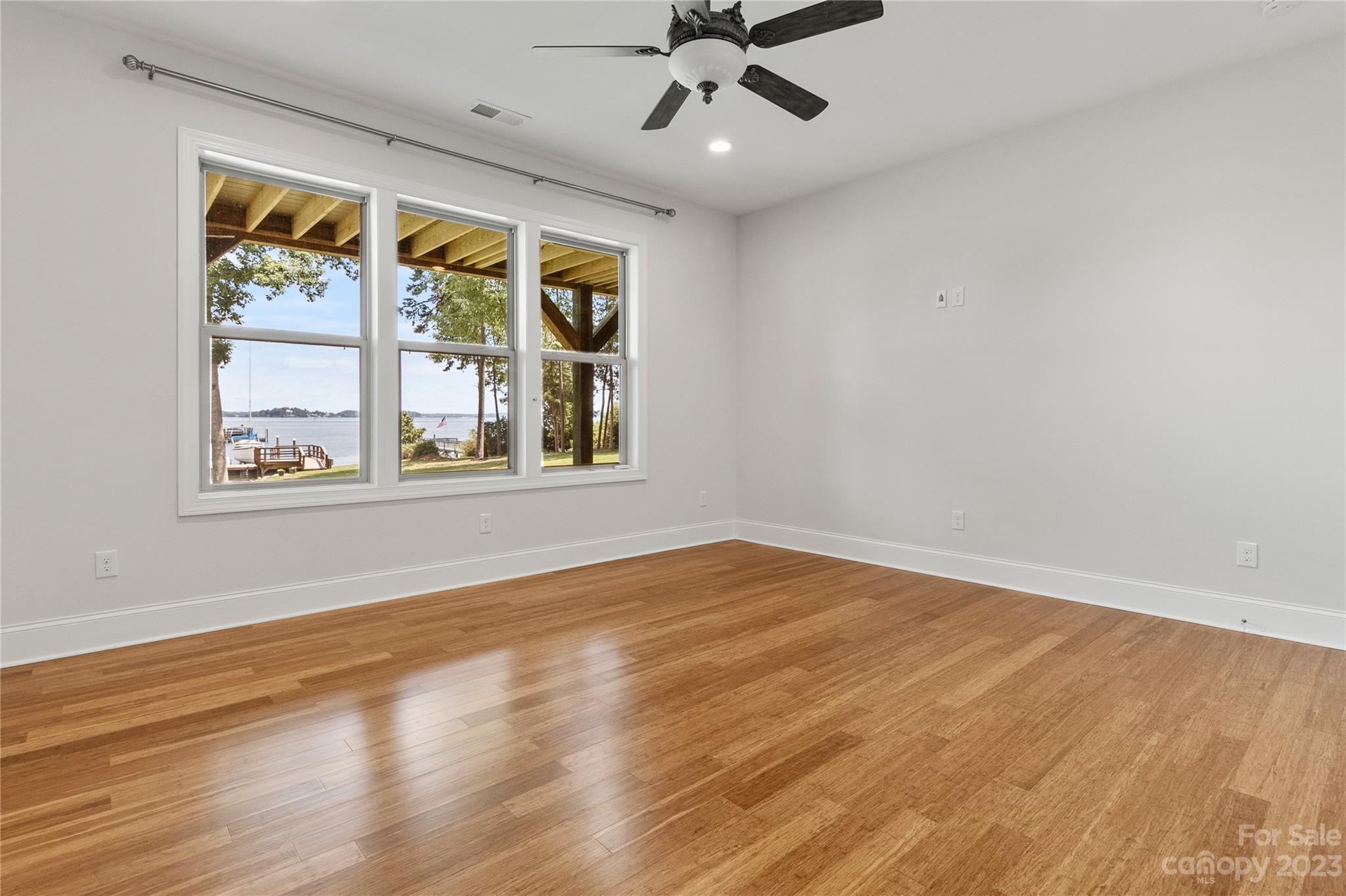 2500 Primm Road Denver, NC 28037 - Photo 28 of 46 a view of an empty room with a window and wooden floor