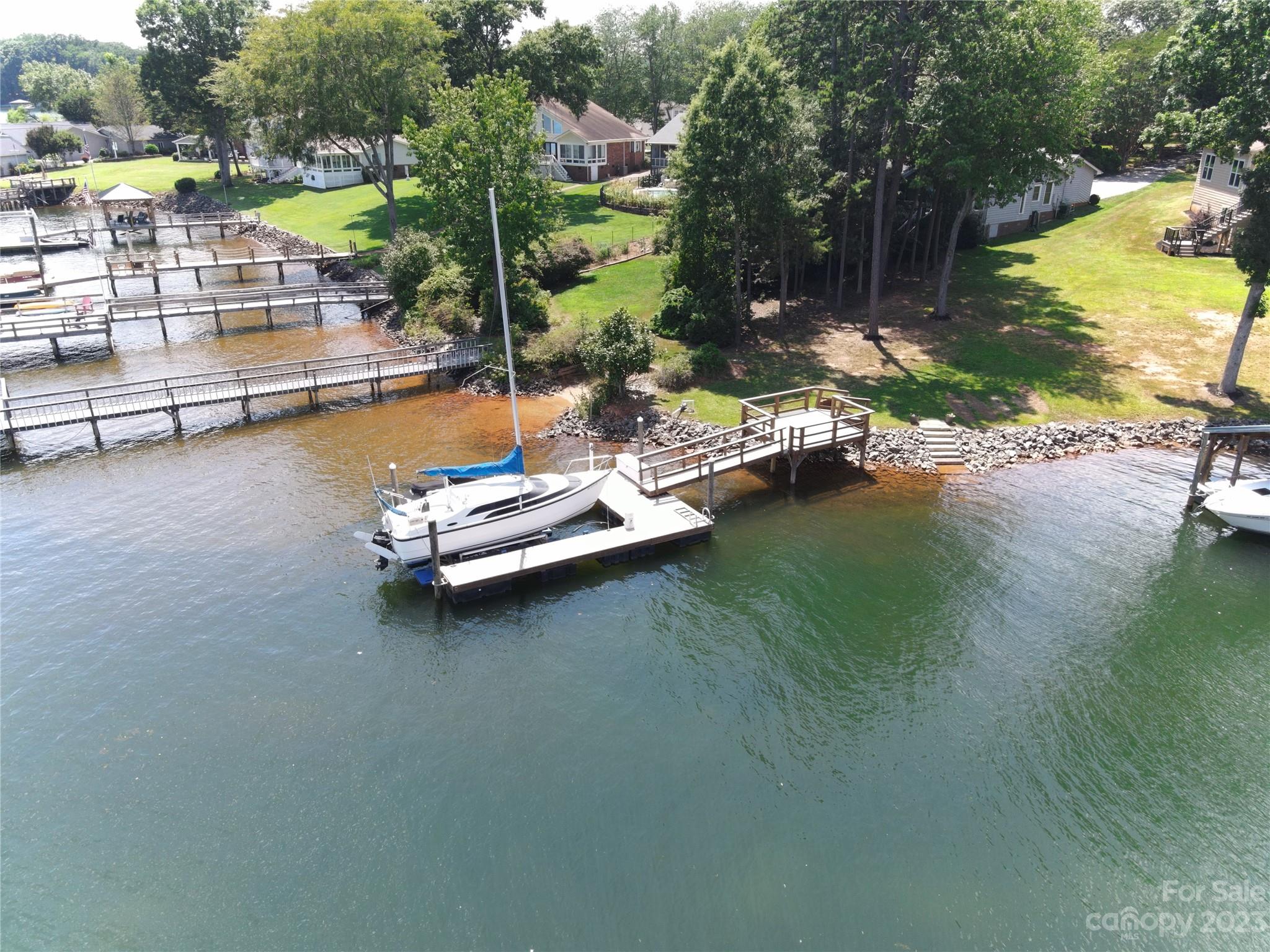 2500 Primm Road Denver, NC 28037 - Photo 41 of 46 a view of a lake with a nearby beach