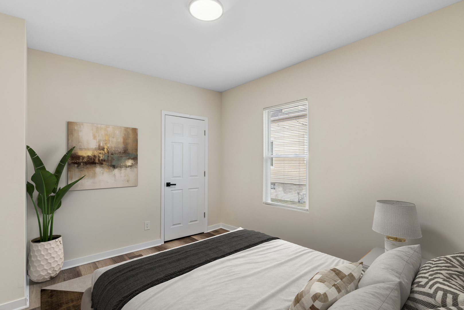 515 George Avenue, Unit 1 Waukegan, IL 60085 - Photo 11 of 15 a bedroom with a bed and a window