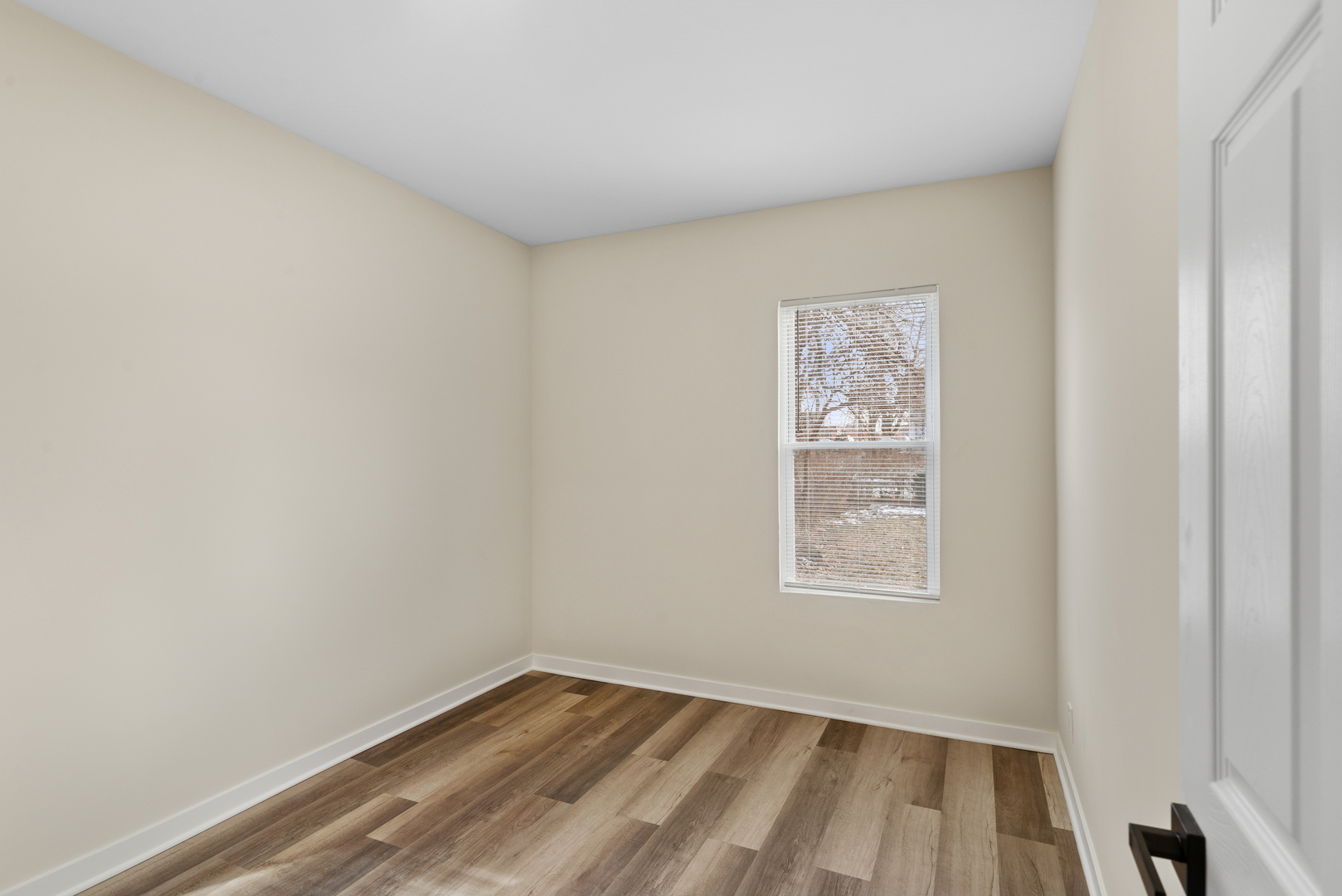 515 George Avenue, Unit 1 Waukegan, IL 60085 - Photo 13 of 15 a view of an empty room with a window