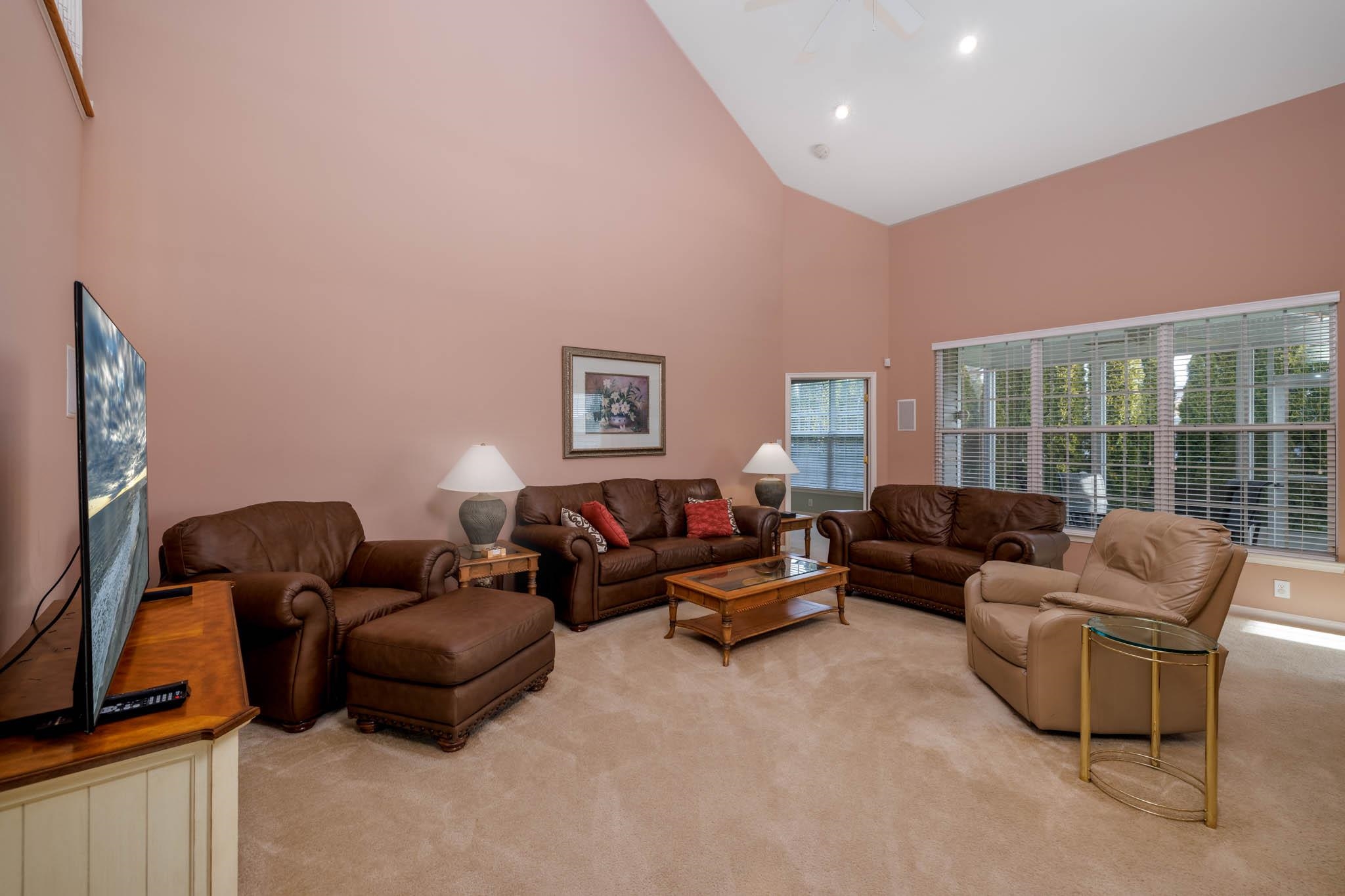 118 Aberdeen Way Rio Grande, NJ 08242 - Photo 13 of 35 a living room with furniture and a flat screen tv