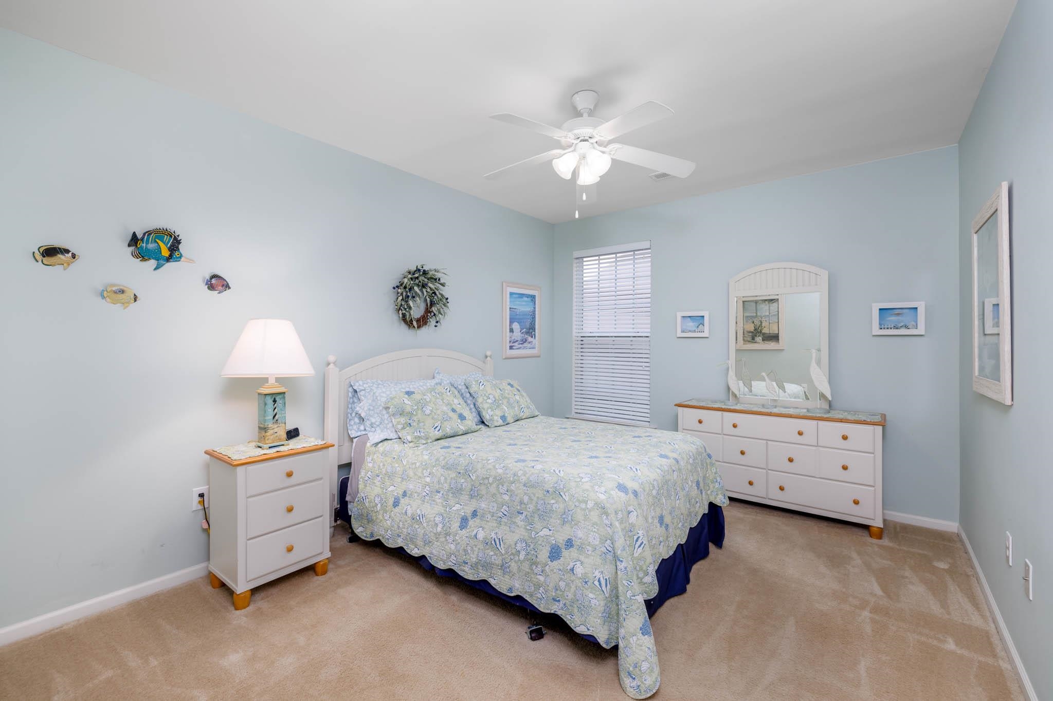 118 Aberdeen Way Rio Grande, NJ 08242 - Photo 21 of 35 a bedroom with a bed and a chandelier