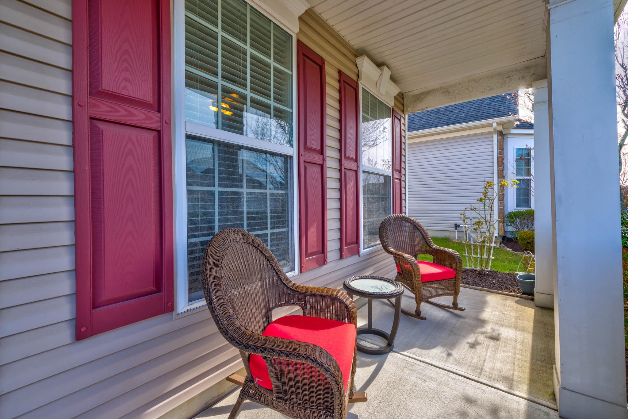 118 Aberdeen Way Rio Grande, NJ 08242 - Photo 4 of 35 a view of a balcony with chair and wooden floor