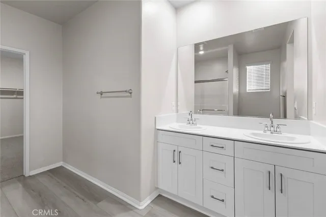 a bathroom with 2 sink and a mirror