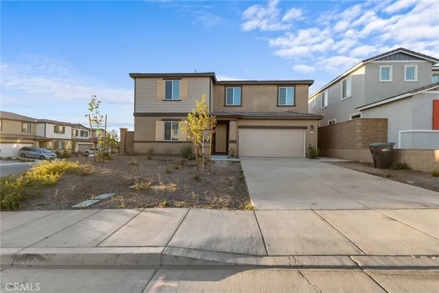 a front view of a house with garage