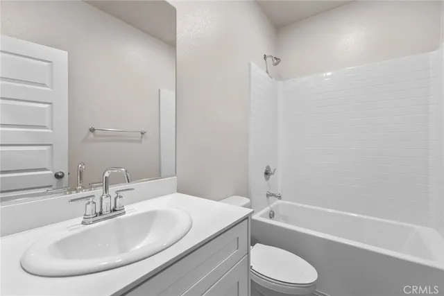 a bathroom with a sink toilet and a bathtub