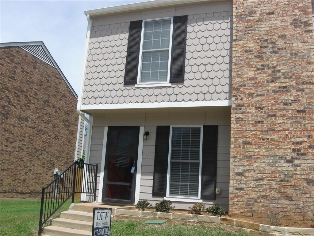 front view of a brick house with a window