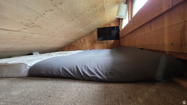 5782 Pineview Loop, Unit 921 Kamas, UT 84036 - Photo 17 of 29 Sloped wood-paneled ceiling with a light wood finish, complemented by wood-paneled walls