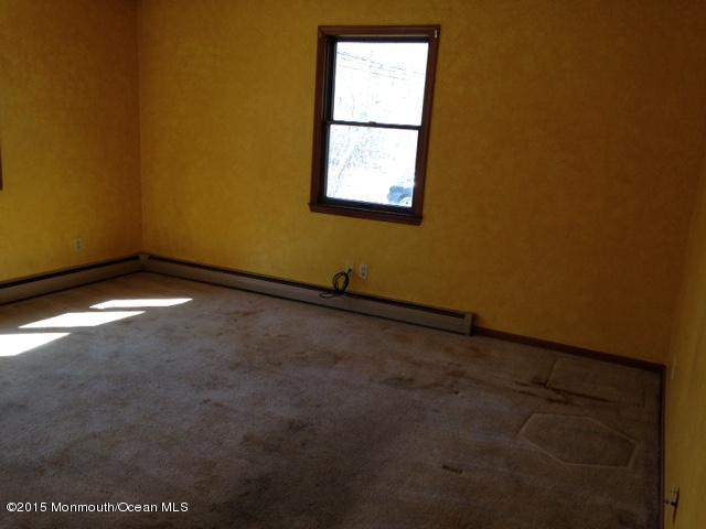 765 Fort Plains Road Howell, NJ 07731 - Photo 3 of 11 an empty room with a window