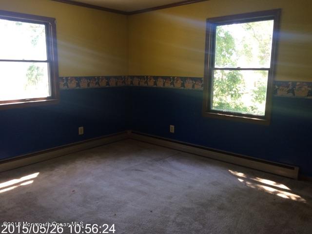 765 Fort Plains Road Howell, NJ 07731 - Photo 5 of 11 a view of an empty room with a window