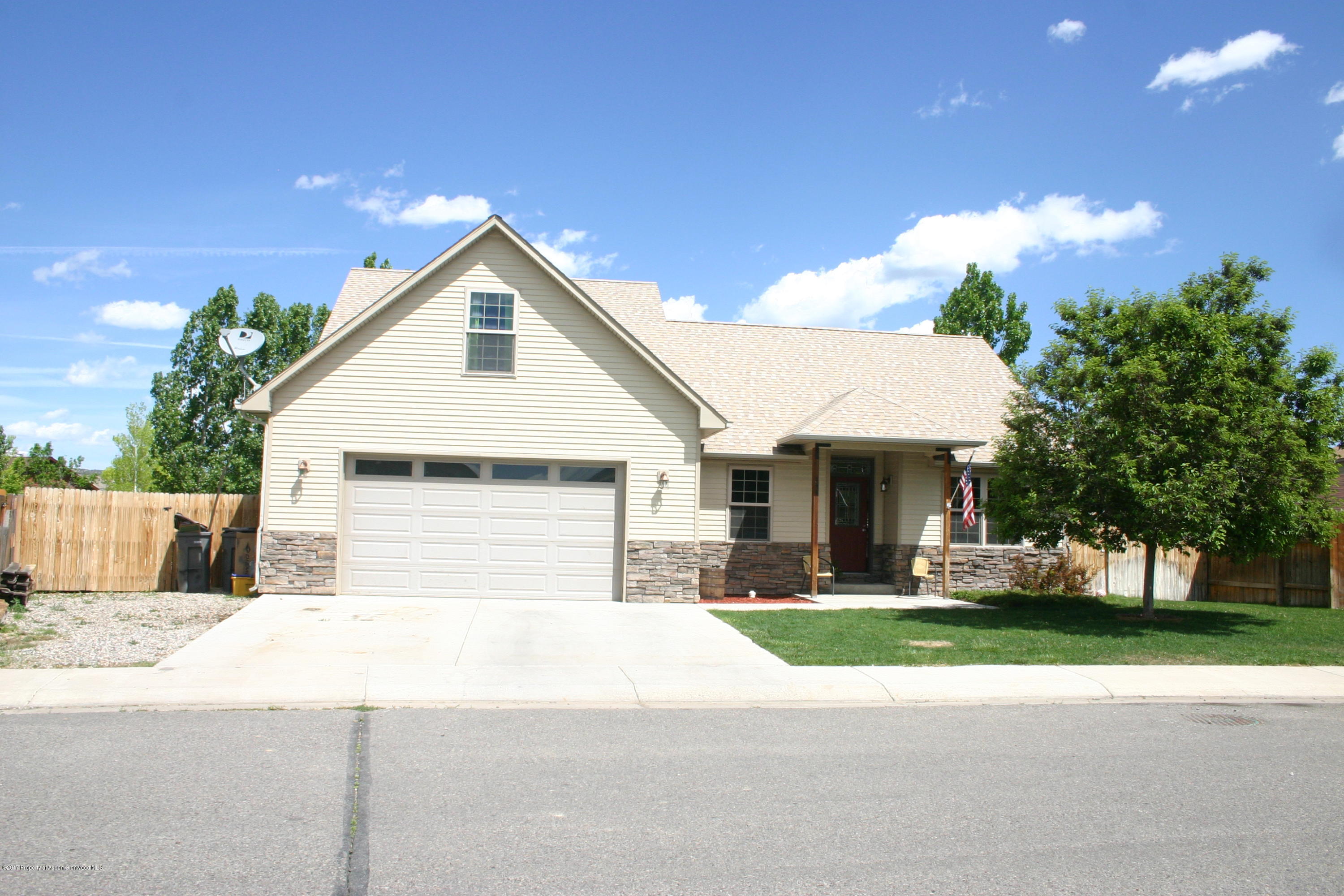 794 East 17th Street Rifle, CO 81650 - Photo 1 of 22 a front view of house with yard and green space