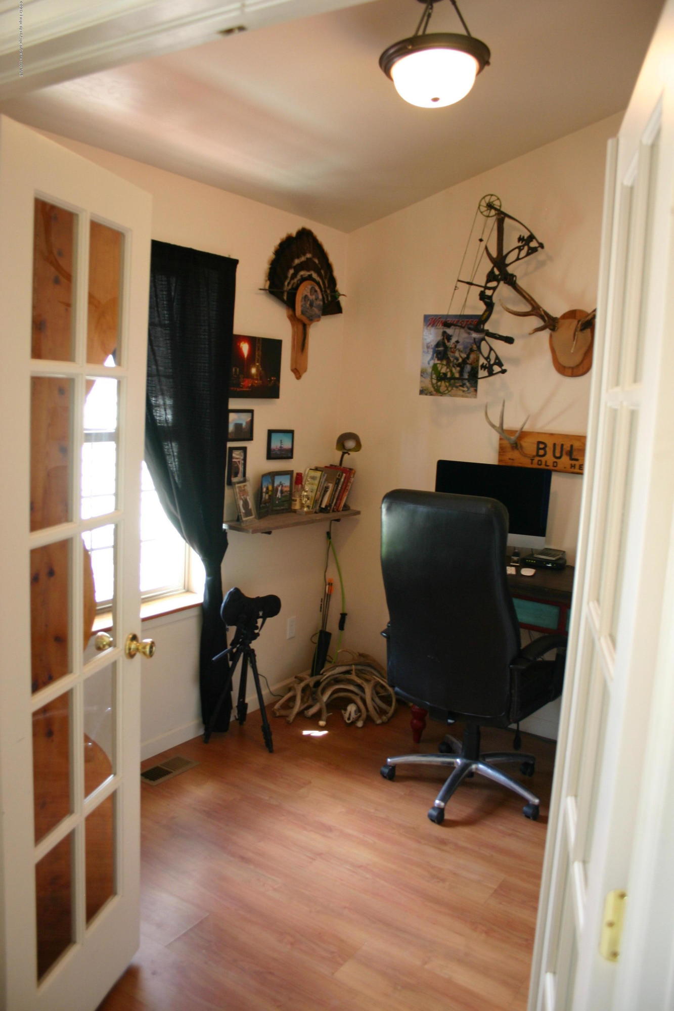 794 East 17th Street Rifle, CO 81650 - Photo 4 of 22 a view of a workspace with furniture and windows