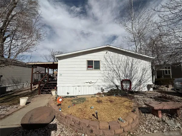 a view of a backyard with sitting area