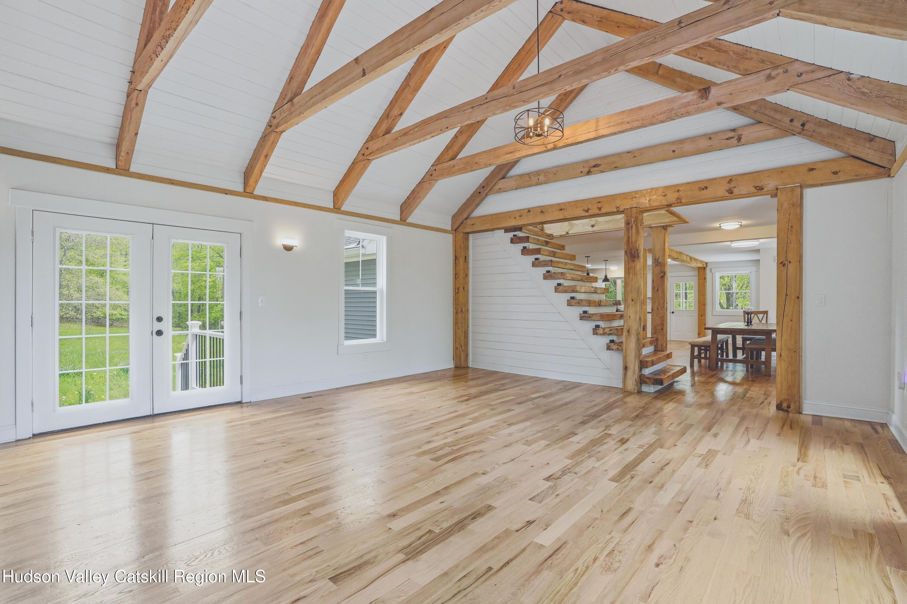 757 Taborton Road Sand Lake, NY 12153 - Photo 13 of 32 a view of an empty room with wooden floor and a window