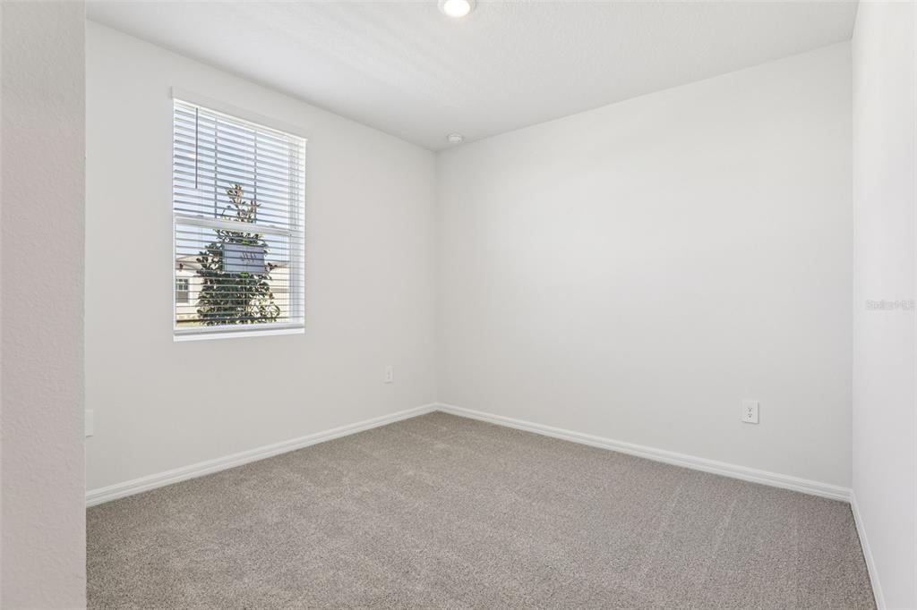 4018 Copperleaf Lane Kissimmee, FL 34759 - Photo 17 of 36 an empty room with a window