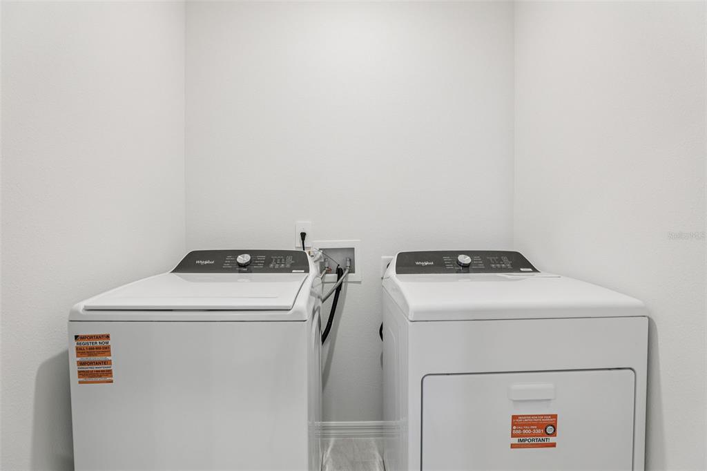 4018 Copperleaf Lane Kissimmee, FL 34759 - Photo 23 of 36 a utility room with dryer and washer