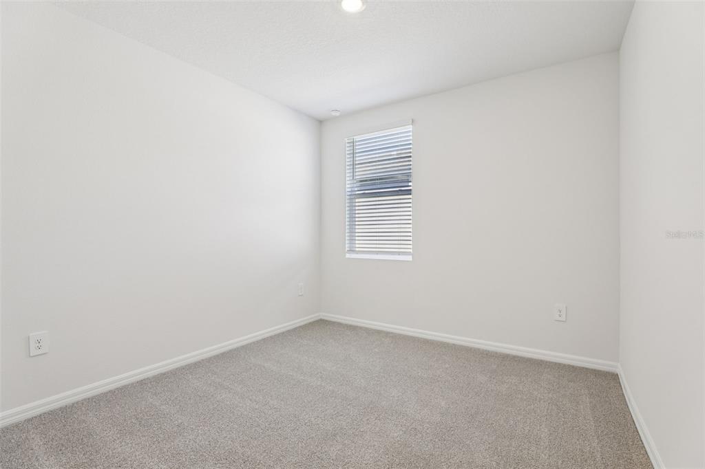 4018 Copperleaf Lane Kissimmee, FL 34759 - Photo 24 of 36 a view of an empty room with a window