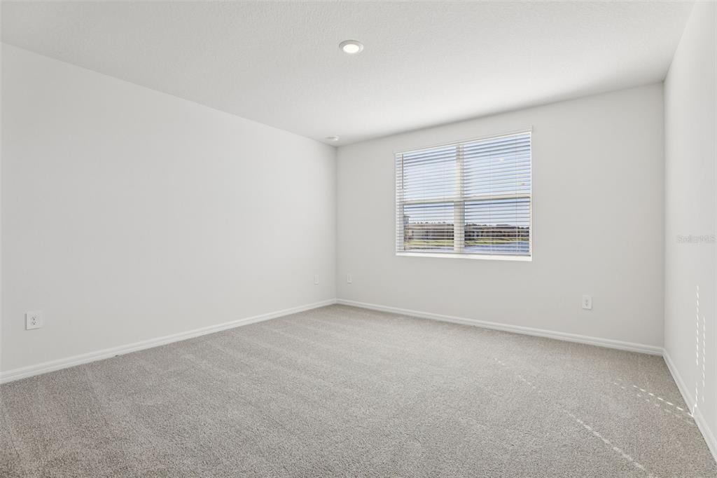 4018 Copperleaf Lane Kissimmee, FL 34759 - Photo 26 of 36 an empty room with windows