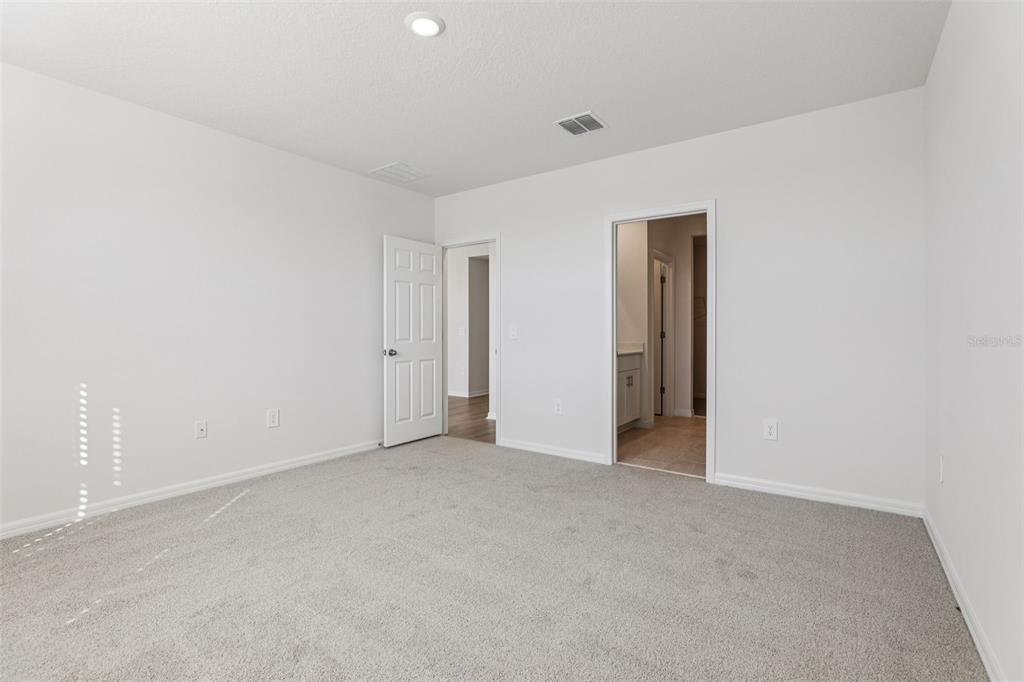 4018 Copperleaf Lane Kissimmee, FL 34759 - Photo 28 of 36 a view of an empty room and closet area