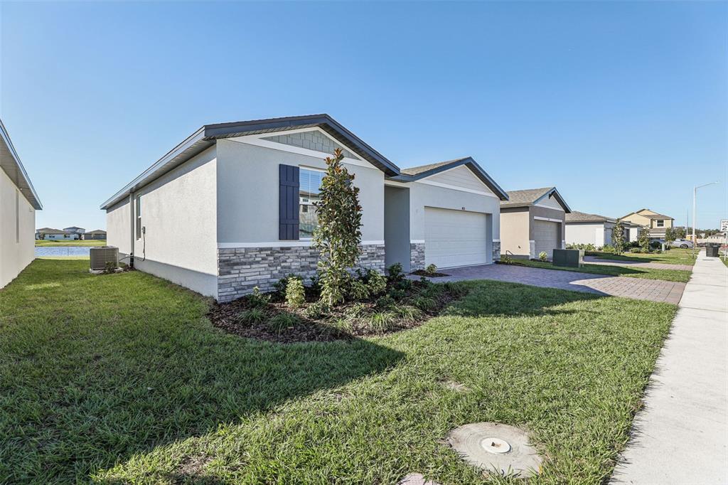 4018 Copperleaf Lane Kissimmee, FL 34759 - Photo 3 of 36 a view of a house with backyard and garden