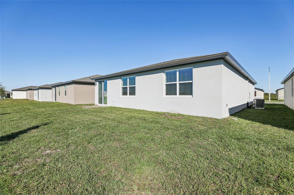 4018 Copperleaf Lane Kissimmee, FL 34759 - Photo 34 of 36 a house view with a backyard space