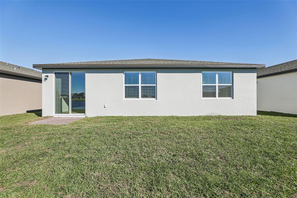 4018 Copperleaf Lane Kissimmee, FL 34759 - Photo 35 of 36 a house view with a garden space