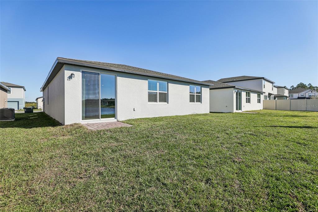 4018 Copperleaf Lane Kissimmee, FL 34759 - Photo 36 of 36 a house view with a garden space