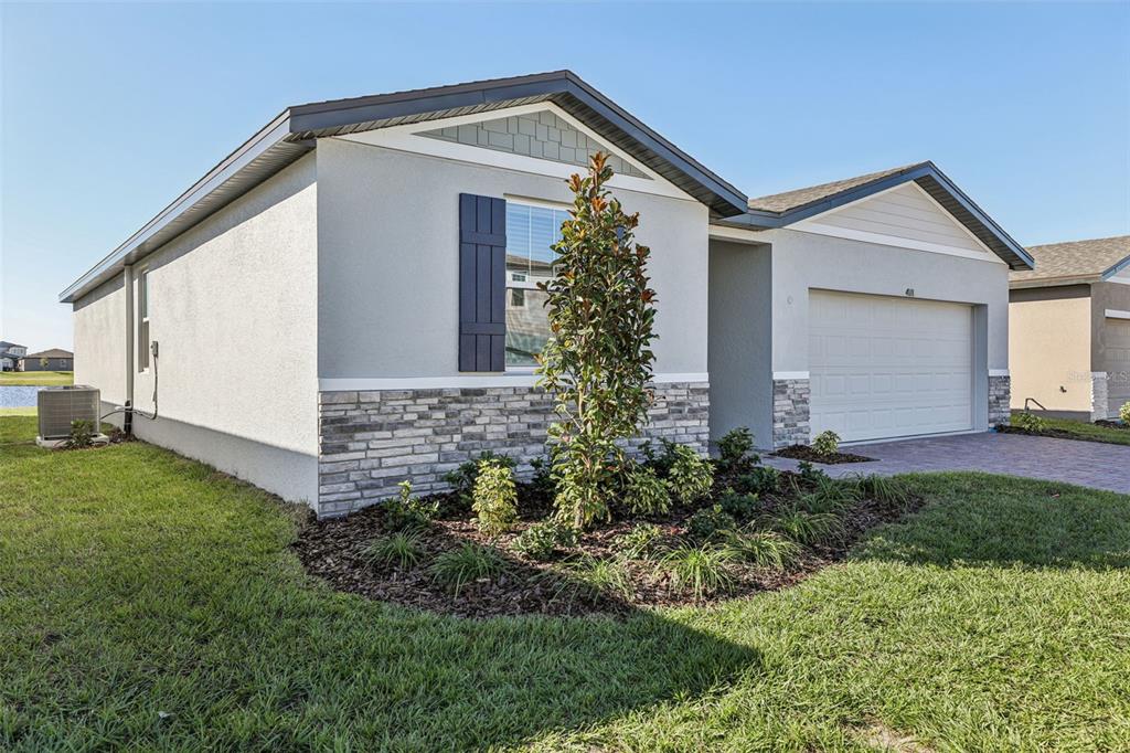 4018 Copperleaf Lane Kissimmee, FL 34759 - Photo 4 of 36 front view of house with a yard