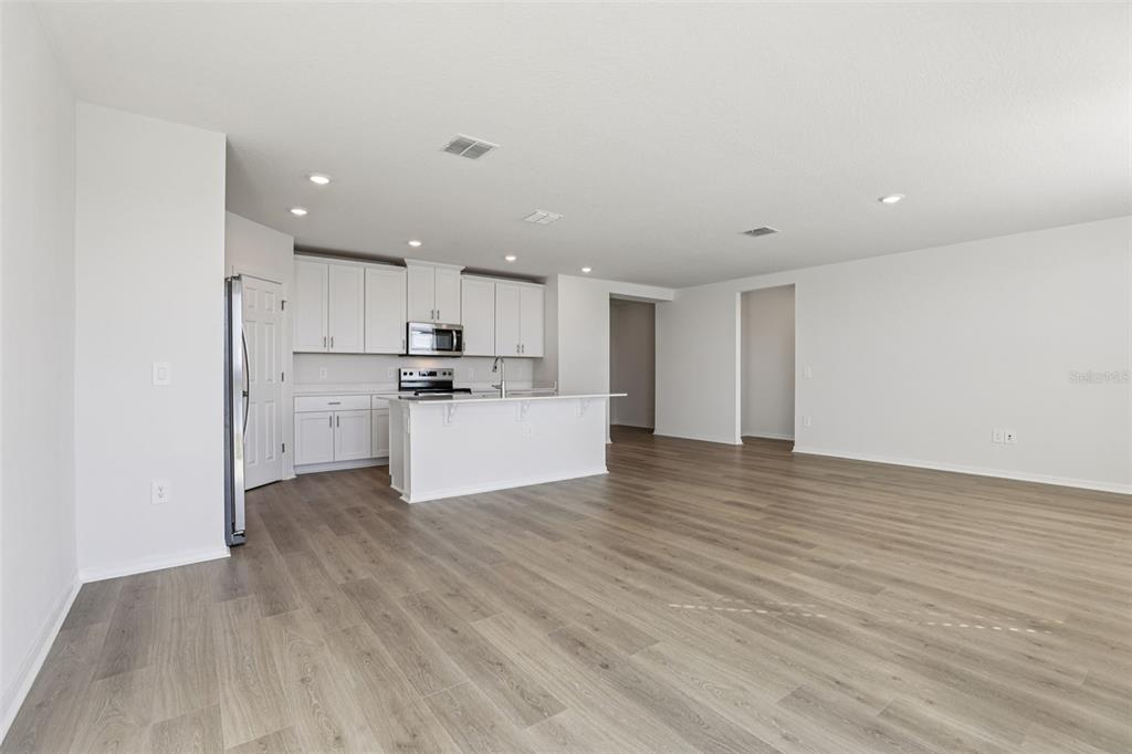 4018 Copperleaf Lane Kissimmee, FL 34759 - Photo 7 of 36 a view of kitchen with wooden floor