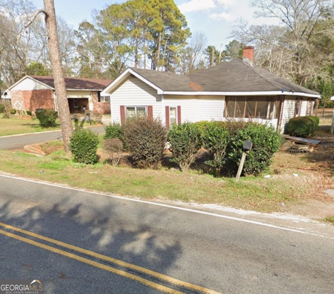 433 Mayo Street Americus, GA 31709 - Photo 2 of 9 a front view of house with yard and green space