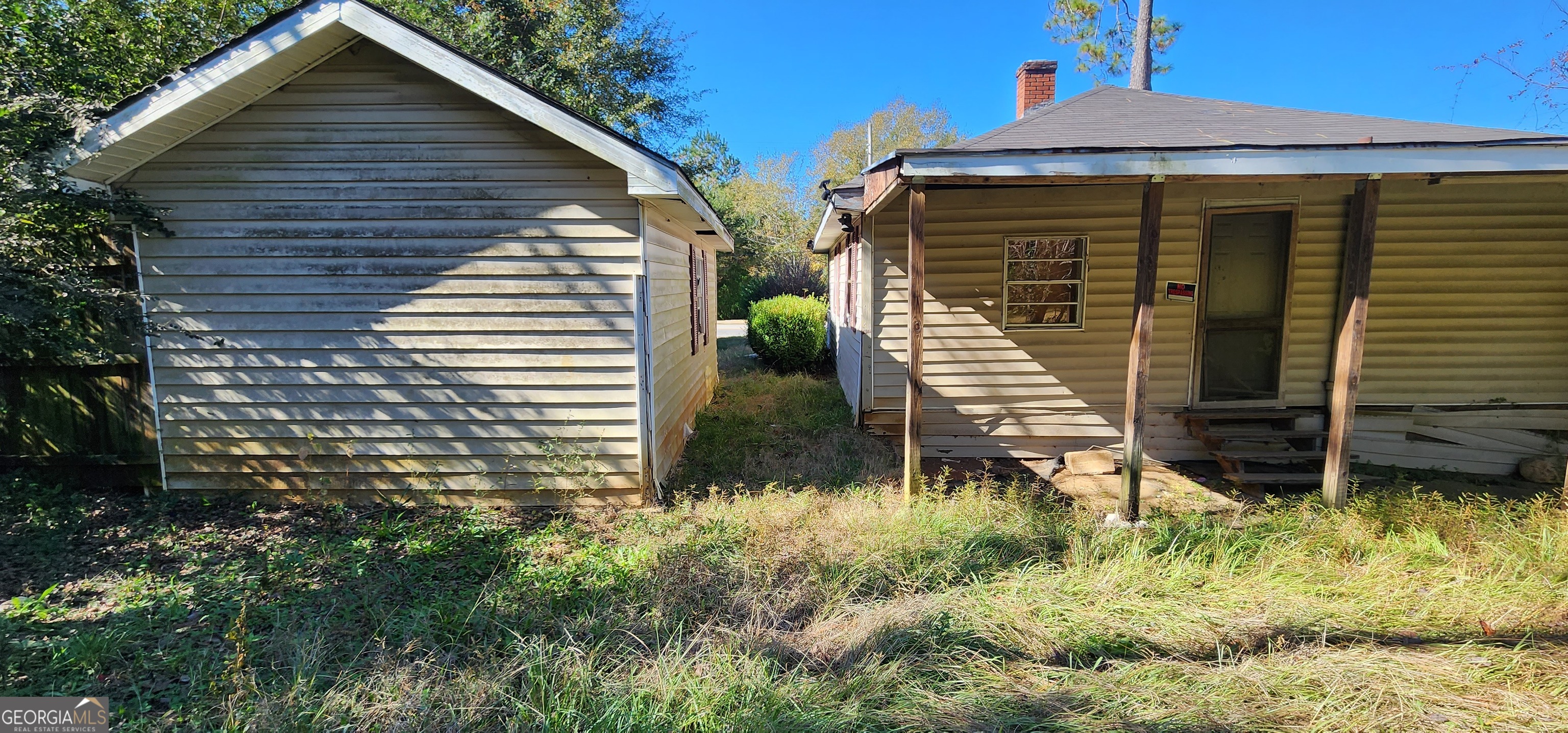 433 Mayo Street Americus, GA 31709 - Photo 8 of 9 a front view of house with yard and trees in the background