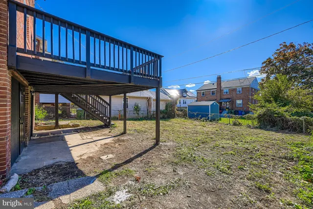 a view of a backyard with a deck