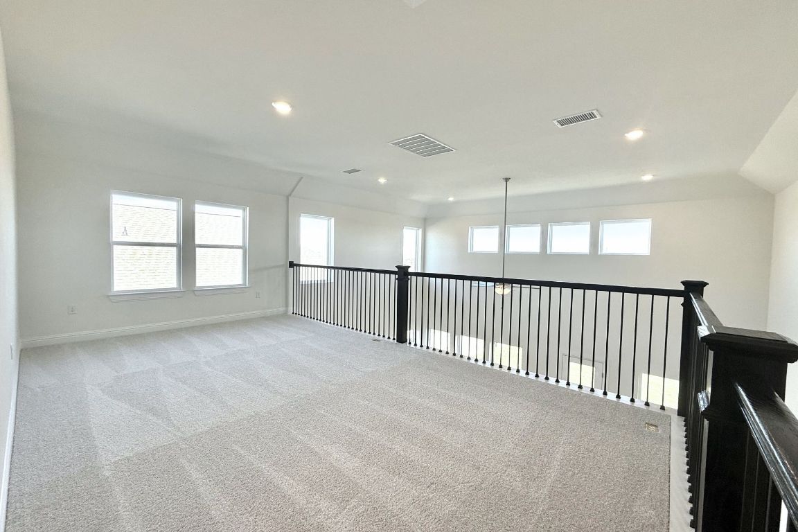 20301 Dustin Lane Pflugerville, TX 78660 - Photo 13 of 30 Spare room with carpet and recessed lighting