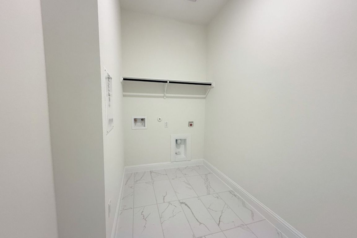 20301 Dustin Lane Pflugerville, TX 78660 - Photo 22 of 30 Laundry area featuring hookup for a gas dryer, light marble finish flooring, and washer hookup