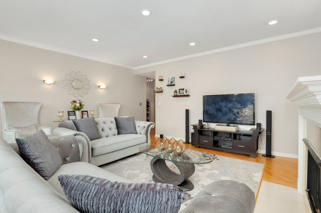4714 South Evans Avenue, Unit 3N Chicago, IL 60615 - Photo 2 of 21 a living room with furniture and a flat screen tv