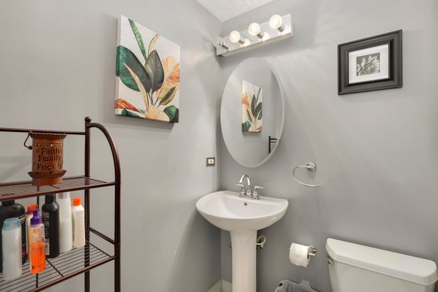 4714 South Evans Avenue, Unit 3N Chicago, IL 60615 - Photo 5 of 21 a bathroom with a sink mirror and toilet