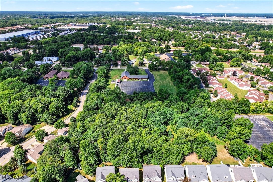 6689 Fry Road Middleburg Heights, OH 44130 - Photo 15 of 17 Aerial view of property's location with nearby suburban area and a tree filled landscape