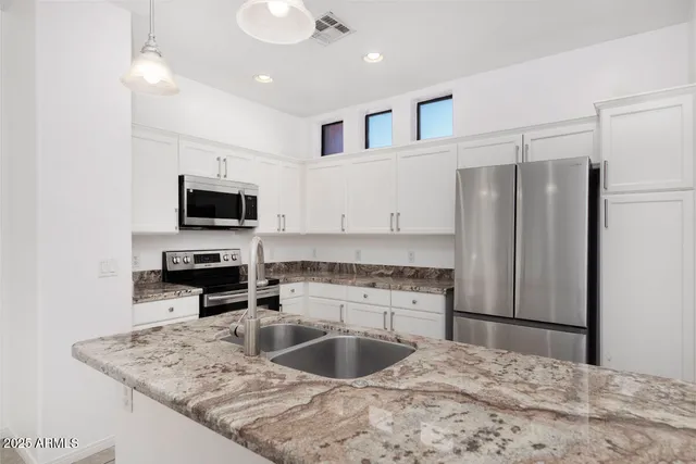 a swimming pool with outdoor seating and yard