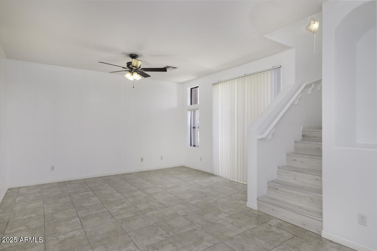 123 North Washington Street, Unit 22 Chandler, AZ 85225 - Photo 10 of 33 wooden floor in an empty room with a ceiling fan