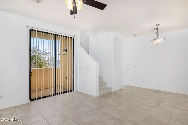 a kitchen with stainless steel appliances granite countertop a sink refrigerator and microwave