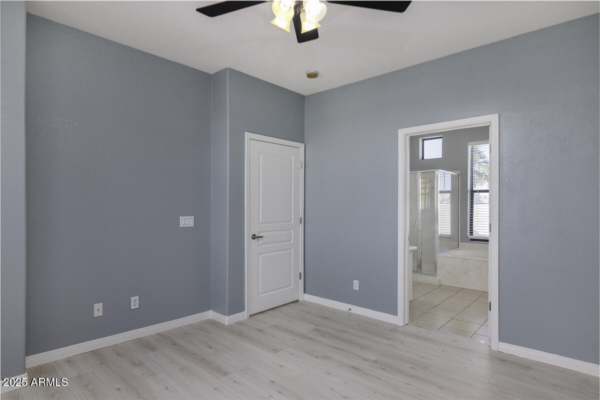 123 North Washington Street, Unit 22 Chandler, AZ 85225 - Photo 13 of 33 wooden floor in an empty room with a window