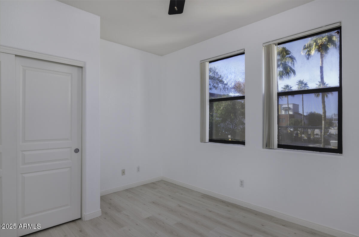 123 North Washington Street, Unit 22 Chandler, AZ 85225 - Photo 17 of 33 an empty room with windows and wall painting