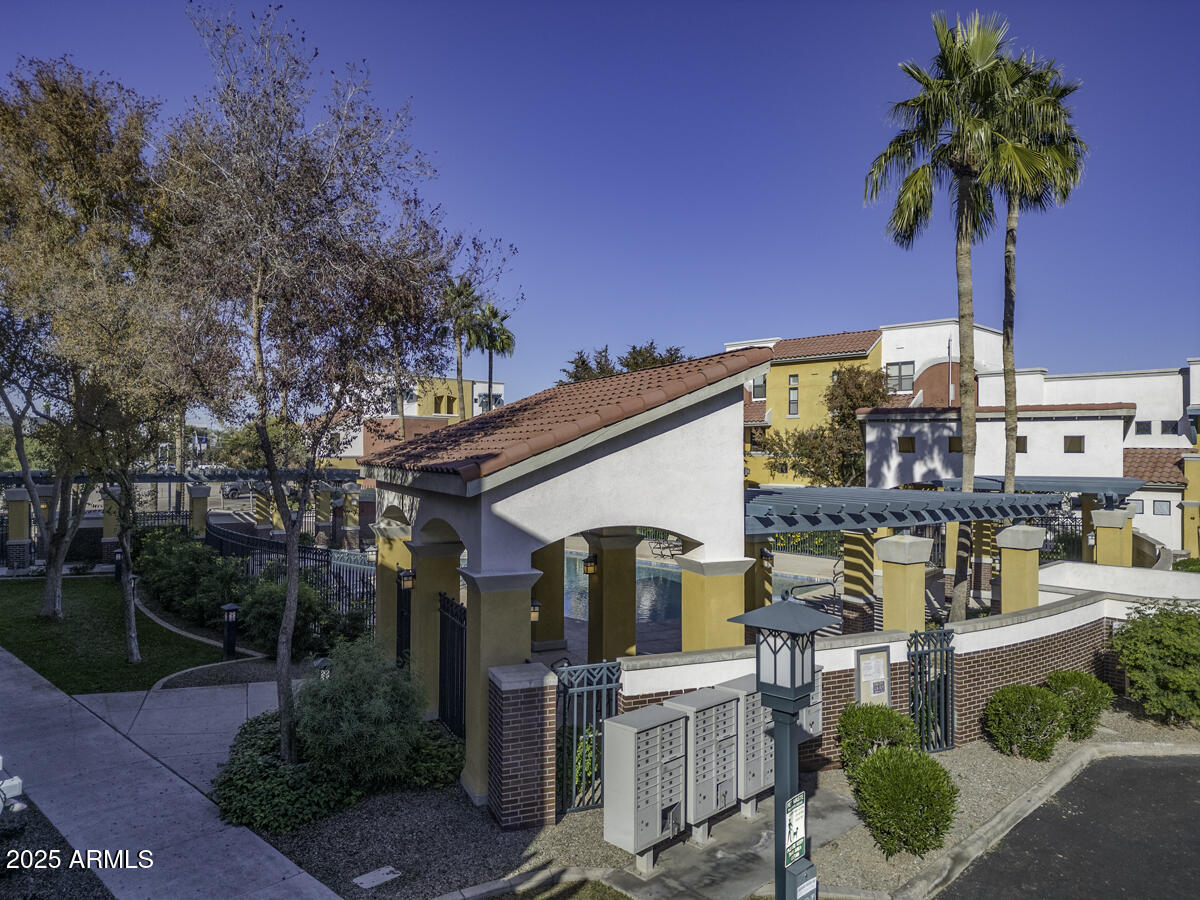 123 North Washington Street, Unit 22 Chandler, AZ 85225 - Photo 26 of 33 a front view of a house with garden and plants